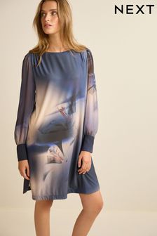 Granatowa w kiwaty - Długa sukienka mini z mankietami na rękawach (472781) | 90 zł