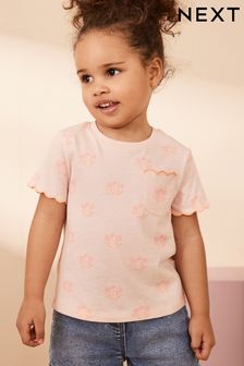 Flor rosa fluorescente - Camiseta de manga corta festoneada (3 meses-7 años) (515119) | 6 € - 8 €
