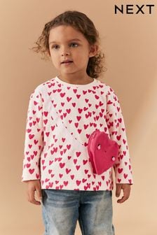 Pinkfarben mit Herzen - Langärmeliges T-Shirt mit Taschenmotiv (3 Monate bis 7 Jahre) (567914) | 7 € - 9 €