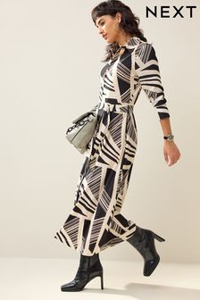 Zwarte/créme print - Midi-jurk met riem, lange mouwen en rits aan de voorkant (739699) | €95