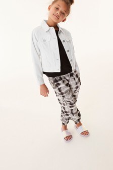 מכנסיים בגזרה רפויה עם הדפס  (גילאי 3 עד 16)