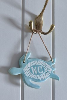 שלט W.C לתלייה מקרמיקה בצורת צב