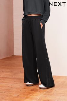 V barvi oglja - Mehke hlače iz džersija s pritiskači ob strani (954103) | €36