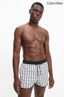 Calvin Klein One - Shorts da running con monogramma bianchi (A34561) | €78
