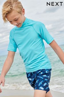כחול  - חולצת שחייה להגנה מפני השמש עם שרוולים קצרים (גילאי ‪1.5-16‬​​​​​​​) (A50794) | ‏31 ₪ - ‏62 ₪