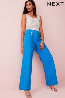 Eleganckie jeansy z szerokimi nogawkami i ozdobnymi złotymi guzikami (A71749) | 127 zł