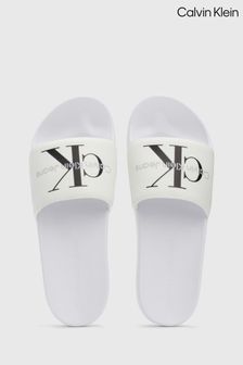 Calvin Klein White Monogram Slides (B83456) | $94