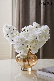 White Artificial Blossom in Gold Vase
