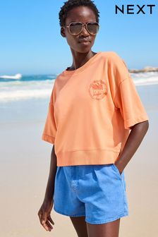 Pomarańczowy - Grubsza koszulka z krótkim rękawem i grafiką (C70429) | 69 zł