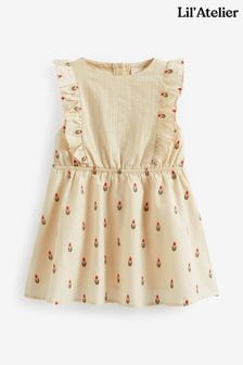 Kremowa sukienka z falbankami Lil Atelier w kwiatowy wzór (D21250) | 165 zł