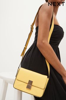 Желтый - Маленькая кожаная сумка с длинным ремешком и застежкой (D21785) | €18