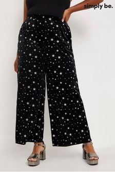 Czarne welurowe spodnie Simply Be z szerokimi nogawkami i nadrukiem w gwiazdy (D56248) | 84 zł