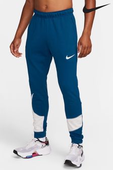 Niebieski - Nike spodnie dresowe ze zwężanymi nogawkami Dri-Fit Fitness Spodnie do biegania (D57119) | 205 zł