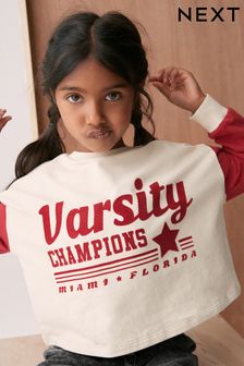 Czerwony z napisem sportowym Varsity - Koszulka z długim rękawem i mankietami z nadrukiem (3-16 lat) (D60244) | 52 zł - 73 zł