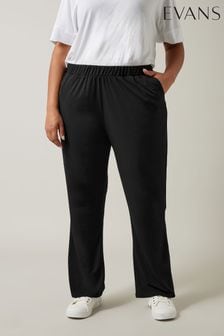 Black trousers wedding guest top