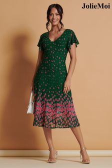 Zelena - Jolie Moi srednje dolga obleka z mrežico in razširjenim krilom  (K98112) | €90
