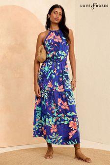 Niebieski w motywy tropikalne - Sukienka midi Love & Roses z dekoltem halter i ozdobnym wykończeniem (K99519) | 290 zł