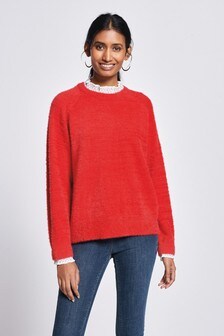 Pull orné à col montant