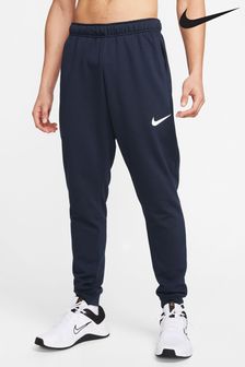 Mornarsko modra - Športne hlače za prosti čas z zoženima hlačnicama Nike Dri-FIT (M43261) | €63