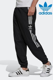 מכנסי חליפת ספורט קלאסיים של adidas Originals דגם Adicolo עם סמל תלתן (M61165) | ‏256 ₪