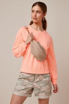 Fluoriserend oranje - Fluorescerend sweatshirt met verlaagde schouder (M71970) | €27