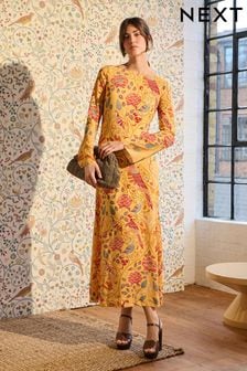 Seasons of May Morris & Co. żółta z kwiatowym wzorem - Sukienka maxi o wydłużonym kroju z długim rękawem (N52458) | 370 zł