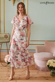Marfil floral - Vestido largo de dama de honor con volante estilo capa y estampado floral de Love & Roses (P70048) | 72 €