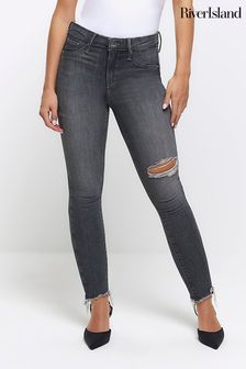 River Island моделирующие джинсы скинни с рваной отделкой (Q45895) | €66