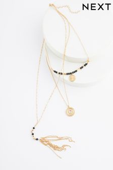 In Goldtönen - Mehrlagige Halskette mit Quastenanhänger (Q67727) | 21 €