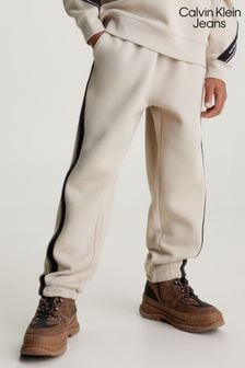 بنطلون رياضي بيكيه لون كريم Cream بخطوط متداخلة من Calvin Klein Jeans (Q85656) | $109