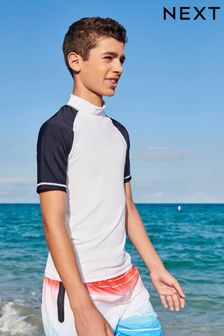 לבן/כחול כהה - חולצת שחייה להגנה מפני השמש עם שרוולים קצרים (גילאי ‪1.5-16‬​​​​​​​) (T02705) | ‏31 ₪ - ‏62 ₪