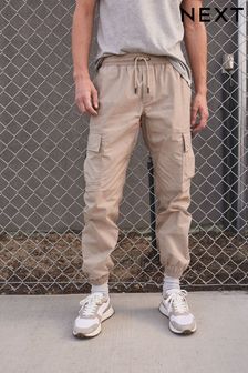Песочный - Эластичные брюки карго с карманами (U74040) | €36