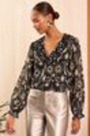 Love & Roses Black Star Ruffle Detail V-Neck Long Sleeve Blouse - Image 1 of 1