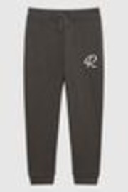 Oliva - Pantalones de chándal de efecto teñido anudado con logo Toby de Reiss - Imagen 1 de 1
