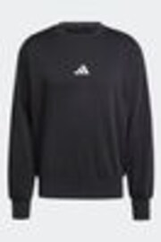 Schwarz - adidas Essentials Feelcozy Fleece Sweatshirt - Bild 1 von 1