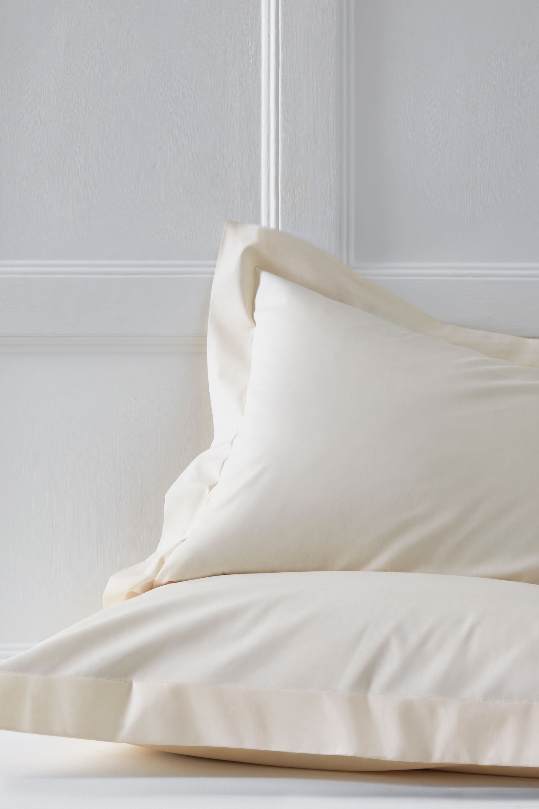 Buy Set of 2 Cream Cotton Rich Pillowcases from the Next UK online shop