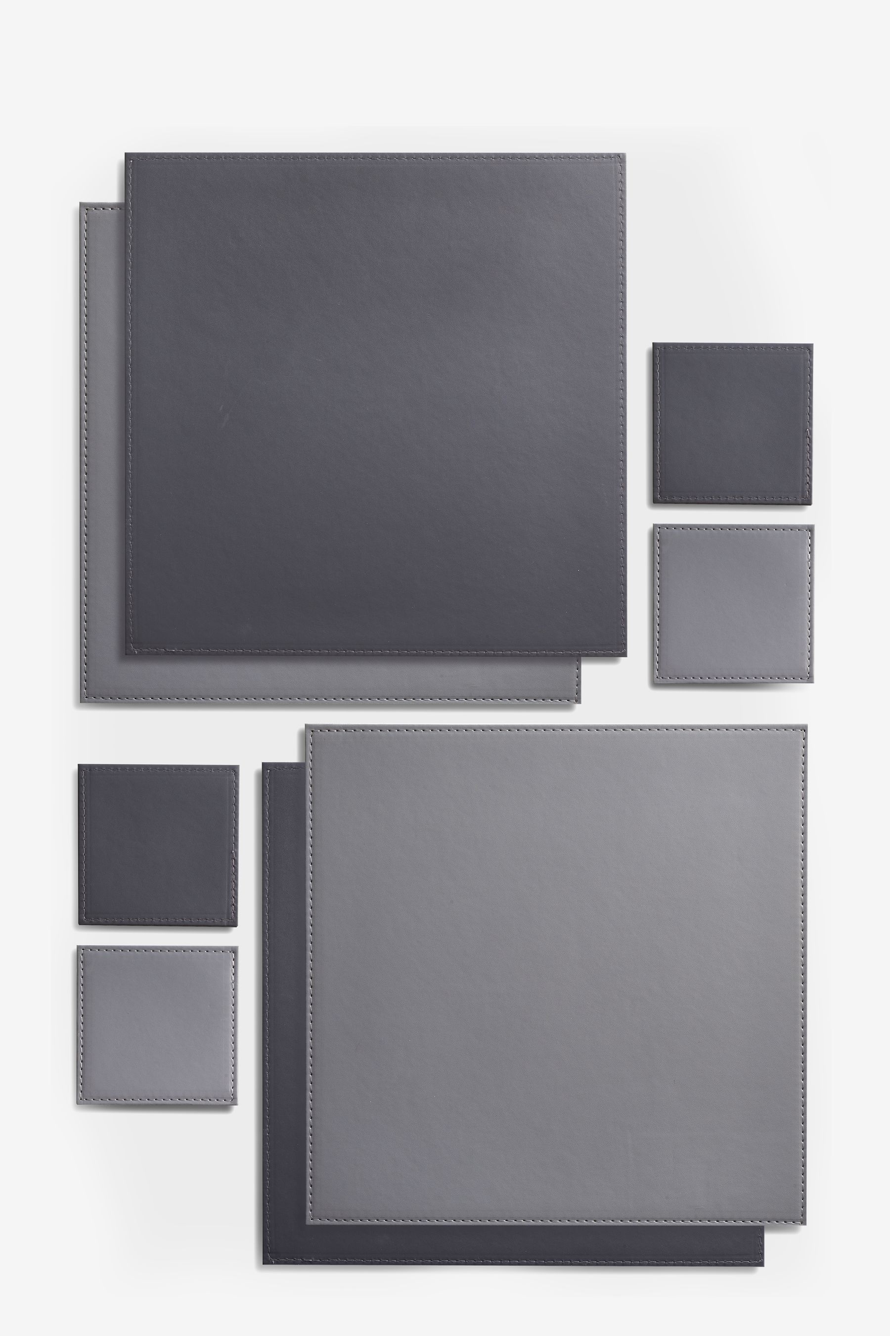 Buy 4 Reversible Faux Leather Placemats And Coasters from the Next UK