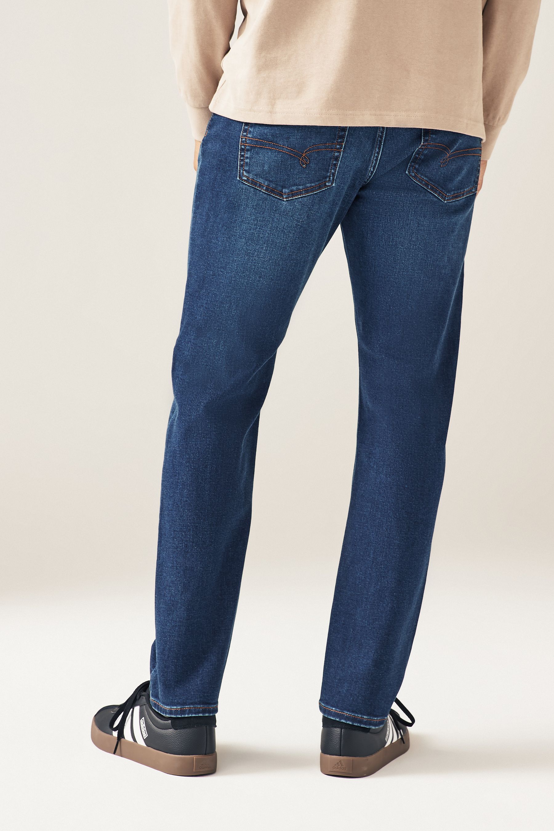 Buy Blue Slim Fit Motion Flex Jeans from the Next UK online shop