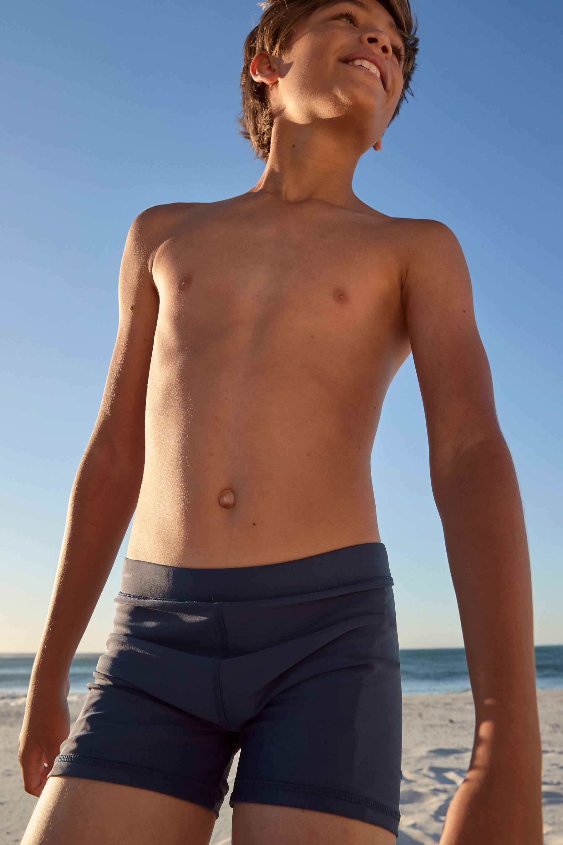 Buy Navy Blue Shorter Length Stretch Swim Shorts (3 16yrs) from the