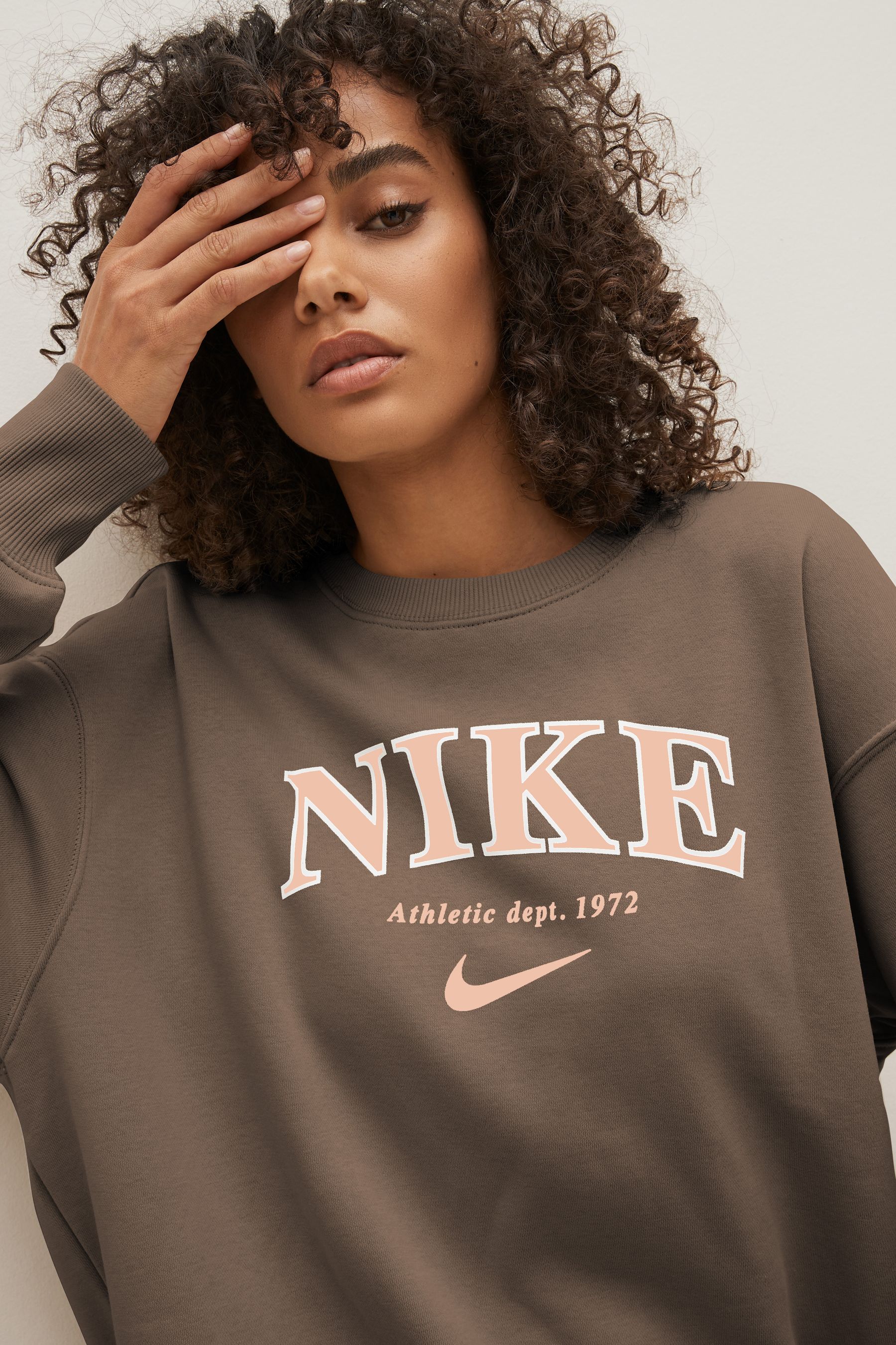 Buy Nike Brown Oversized Varsity Crew Sweatshirt from the Next UK ...