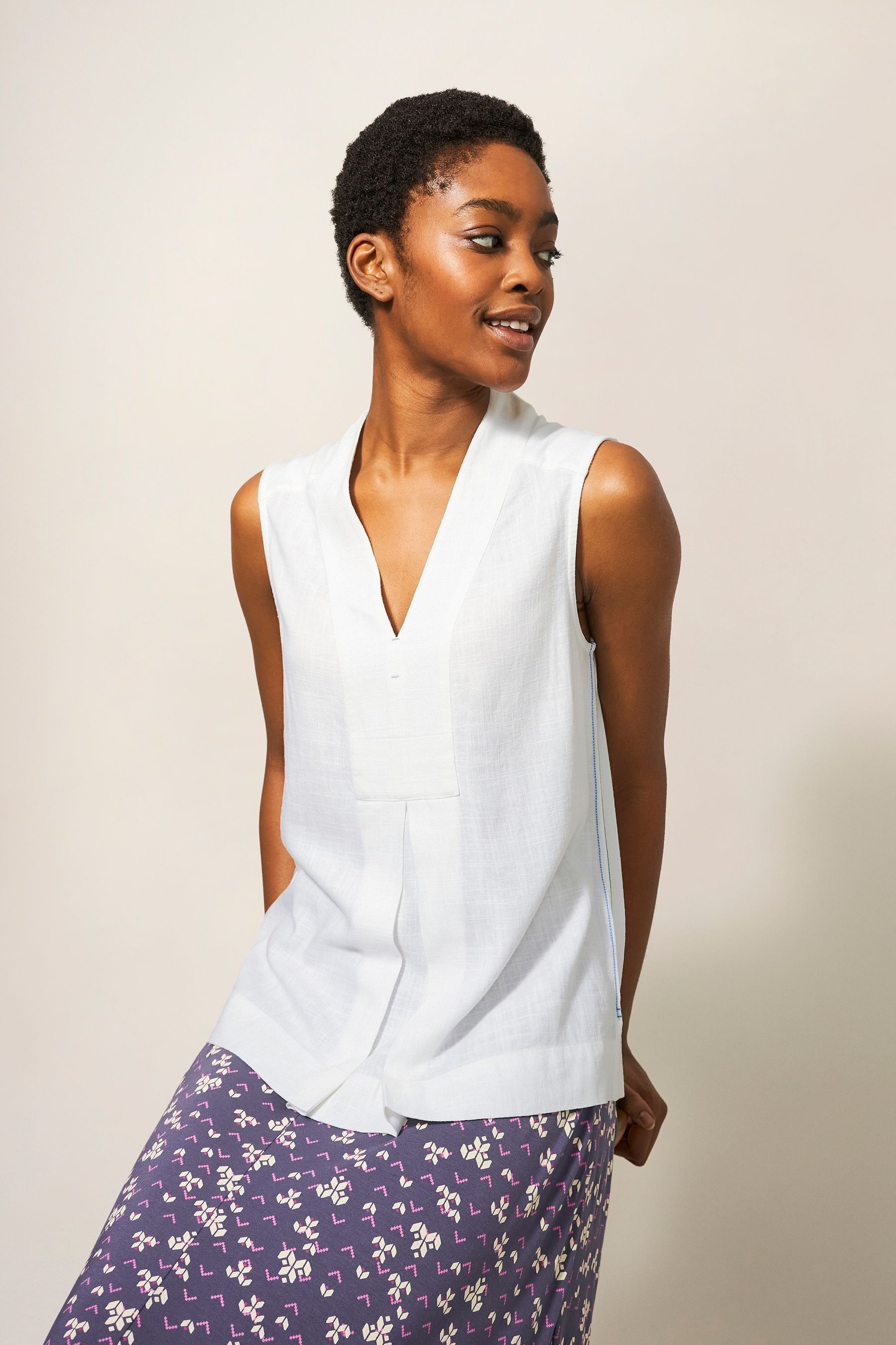 CLEVA WHITE SLEEVELESS BLOUSE