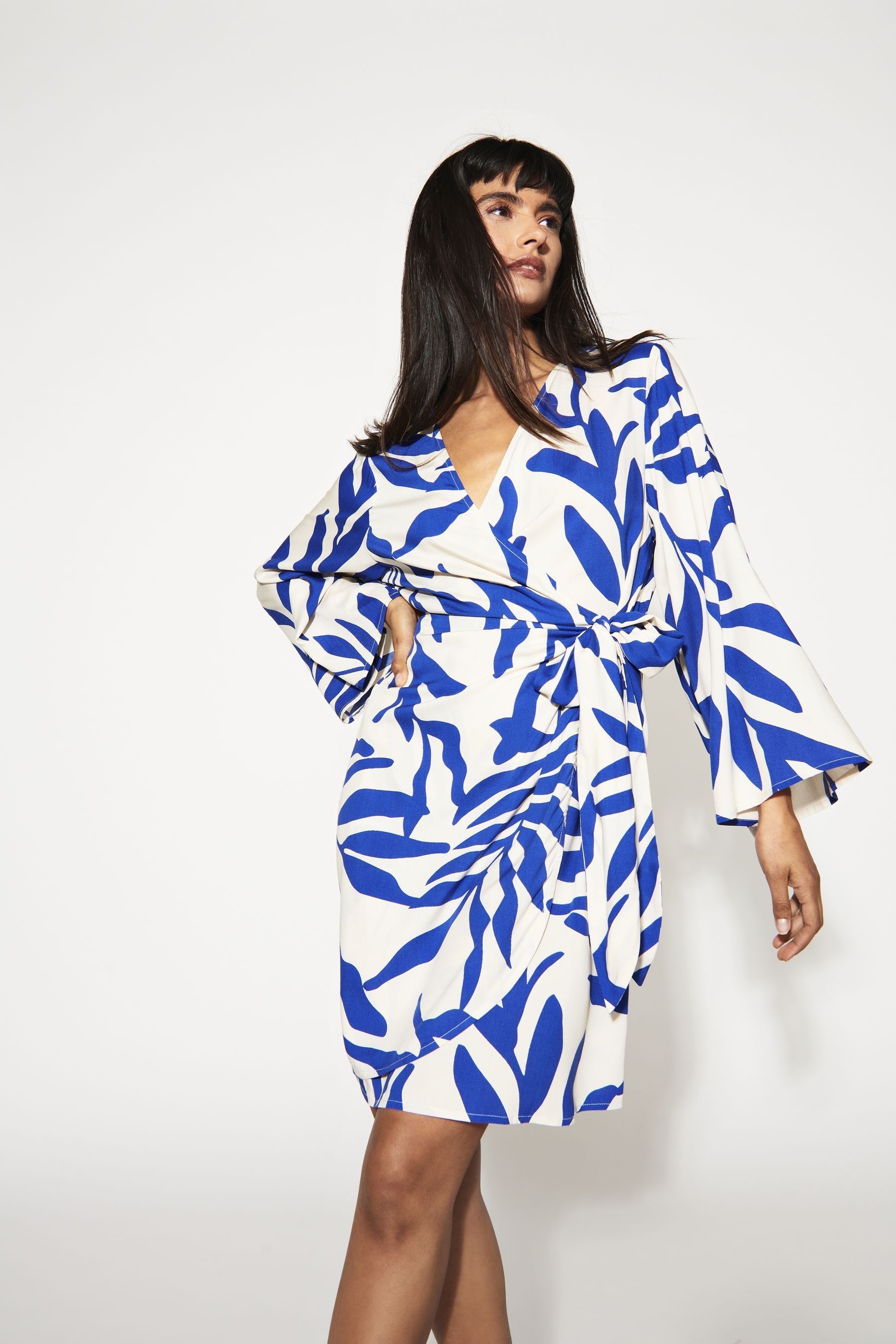 Buy JDY Blue Leaf Print Wrap Mini Dress from the Next UK online shop image.