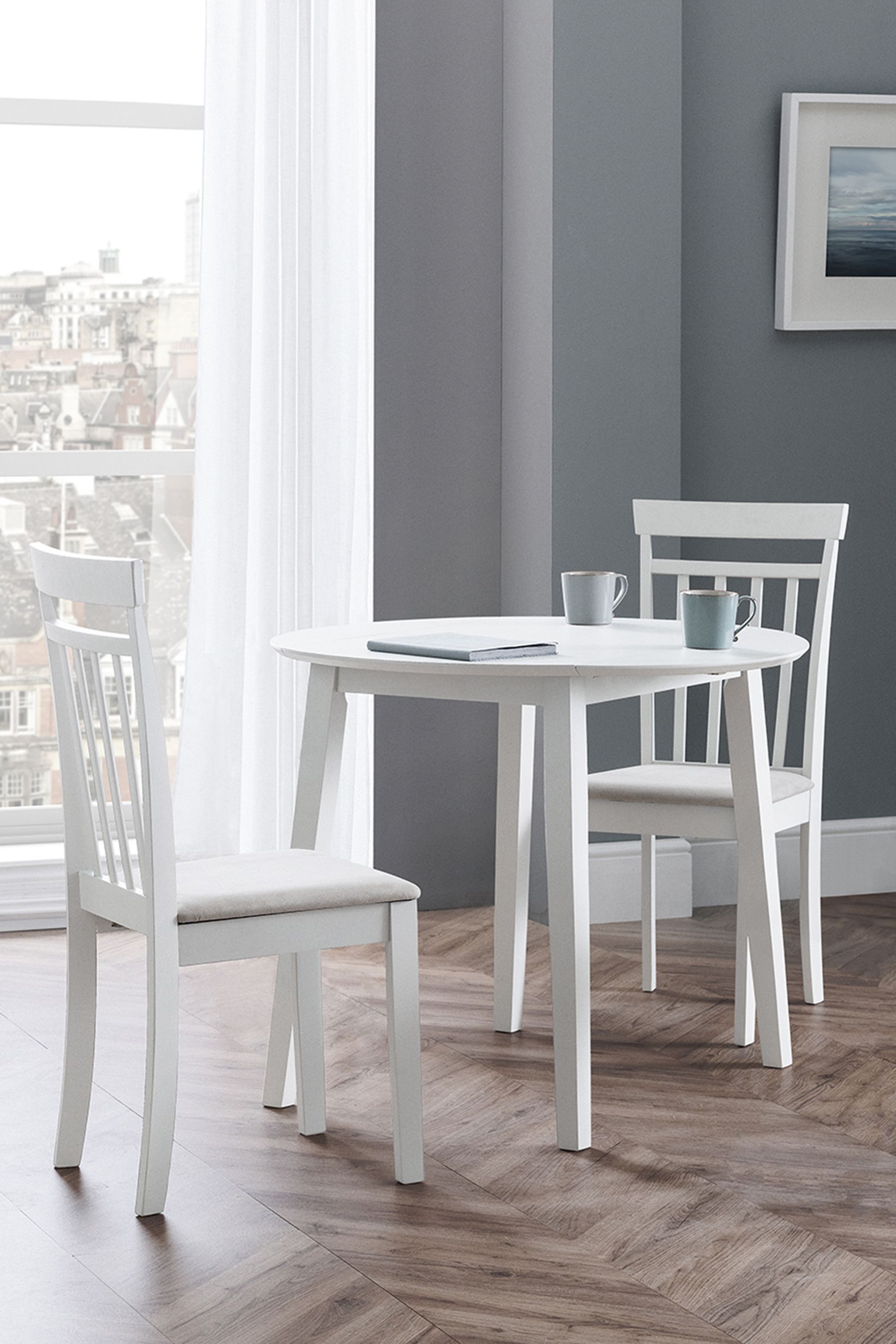 Buy Julian Bowen White Coast Double Drop Leaf Round 4 Seater Dining Set