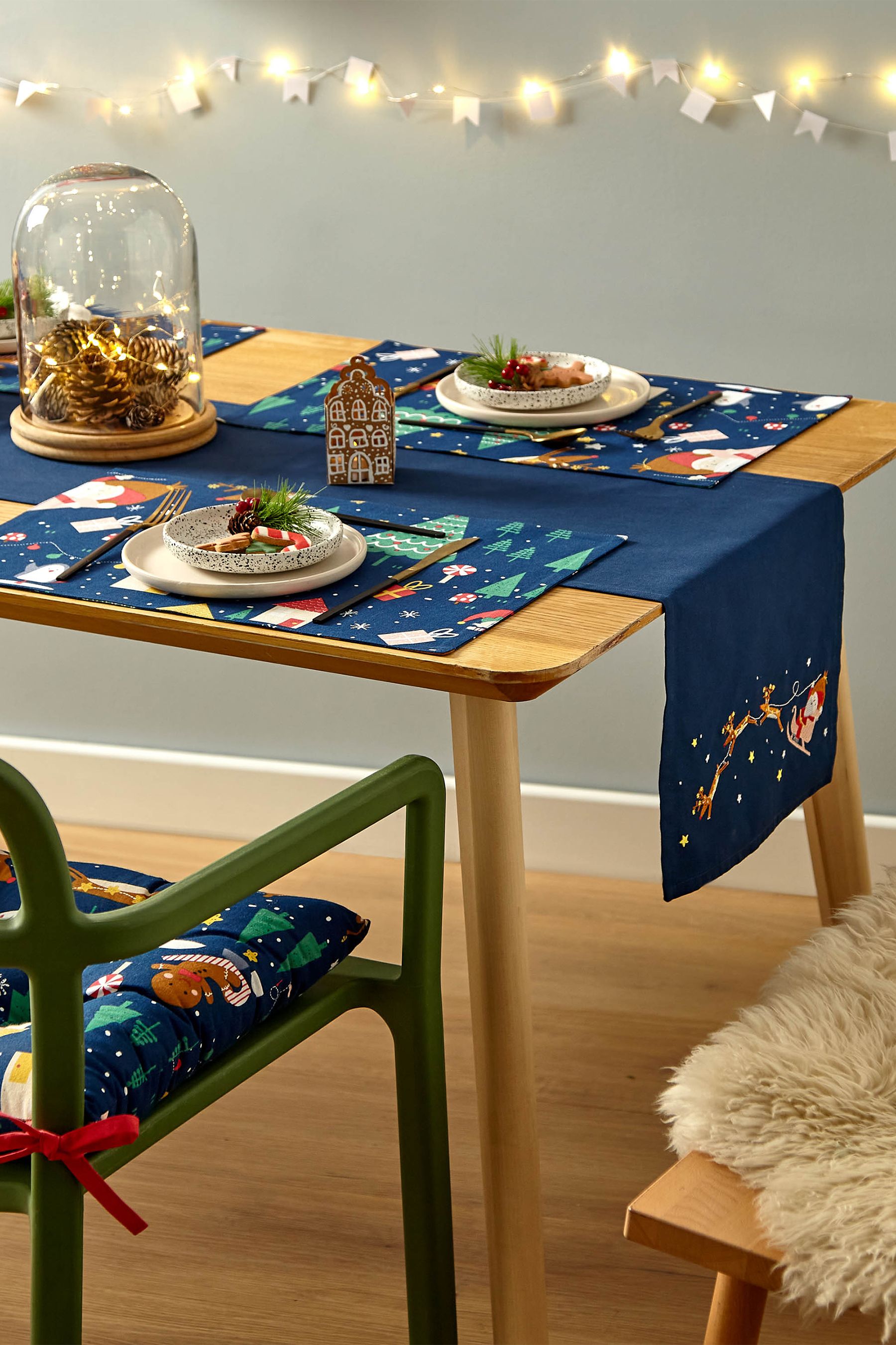 Buy Catherine Lansfield Blue Santa's Christmas Wonderland Wipeable