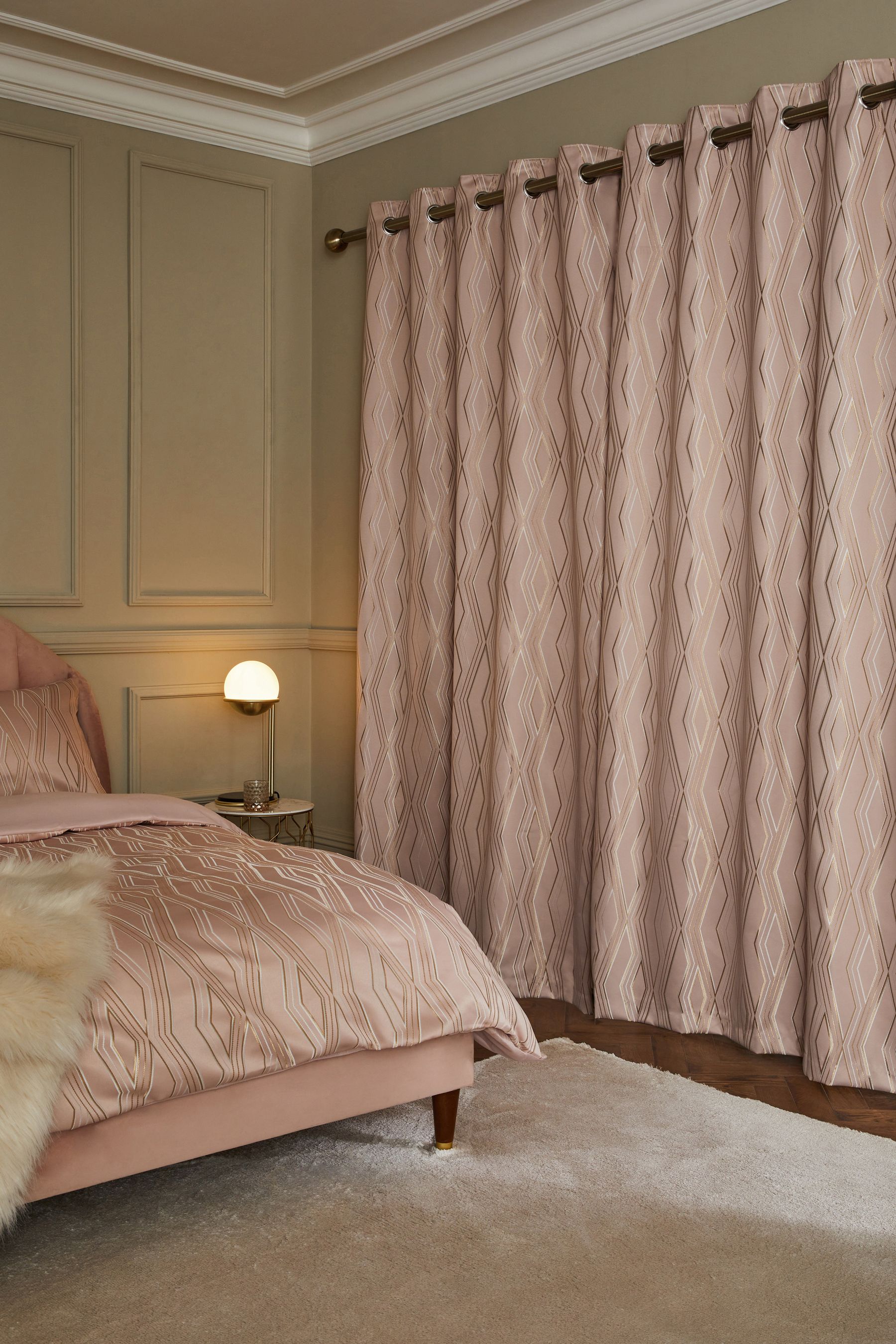 Buy Pink Diamond Jacquard Geometric Eyelet Lined Curtains from the Next