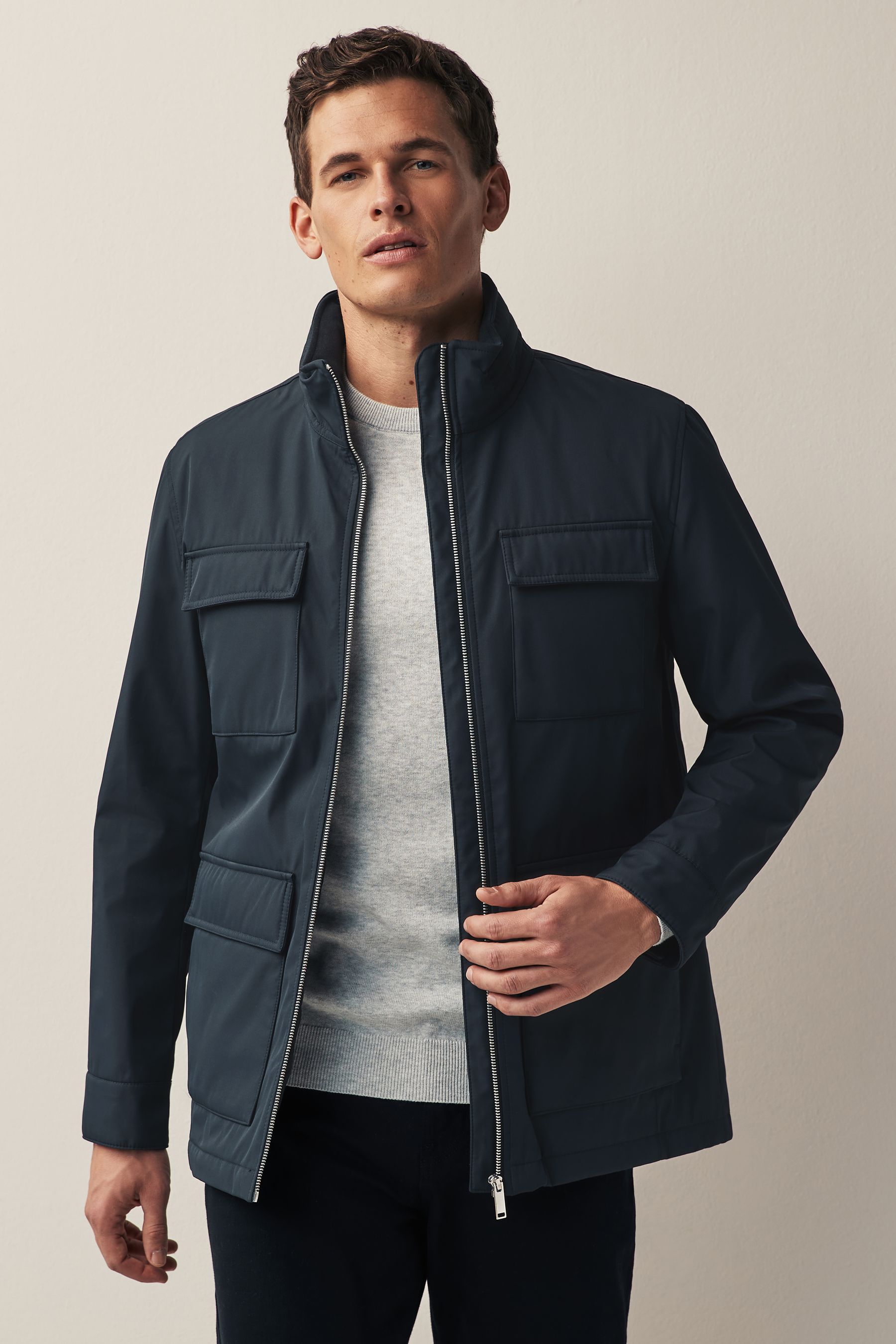 Buy Navy Blue Shower Resistant Four Pocket Funnel Neck Jacket from Next