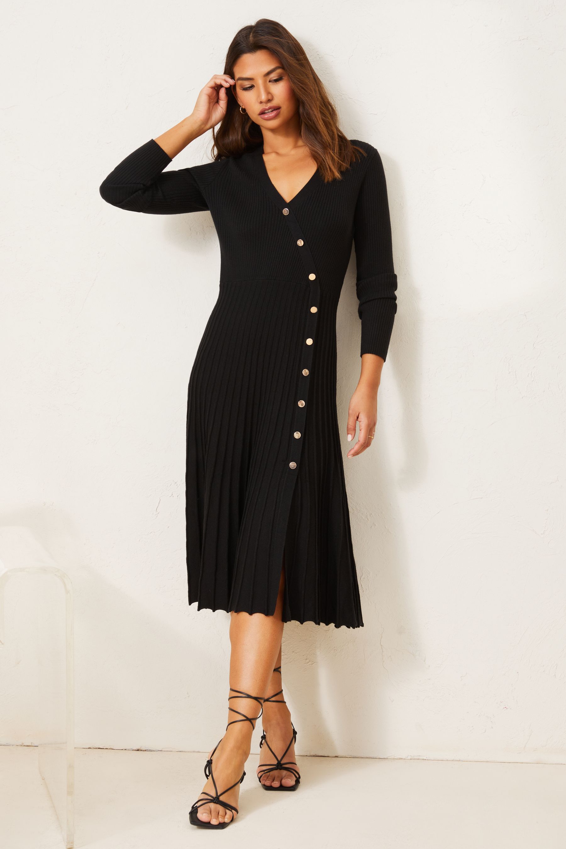 Buy Lipsy Black Long Sleeve Knitted Wrap Button Pleated Dress from Next