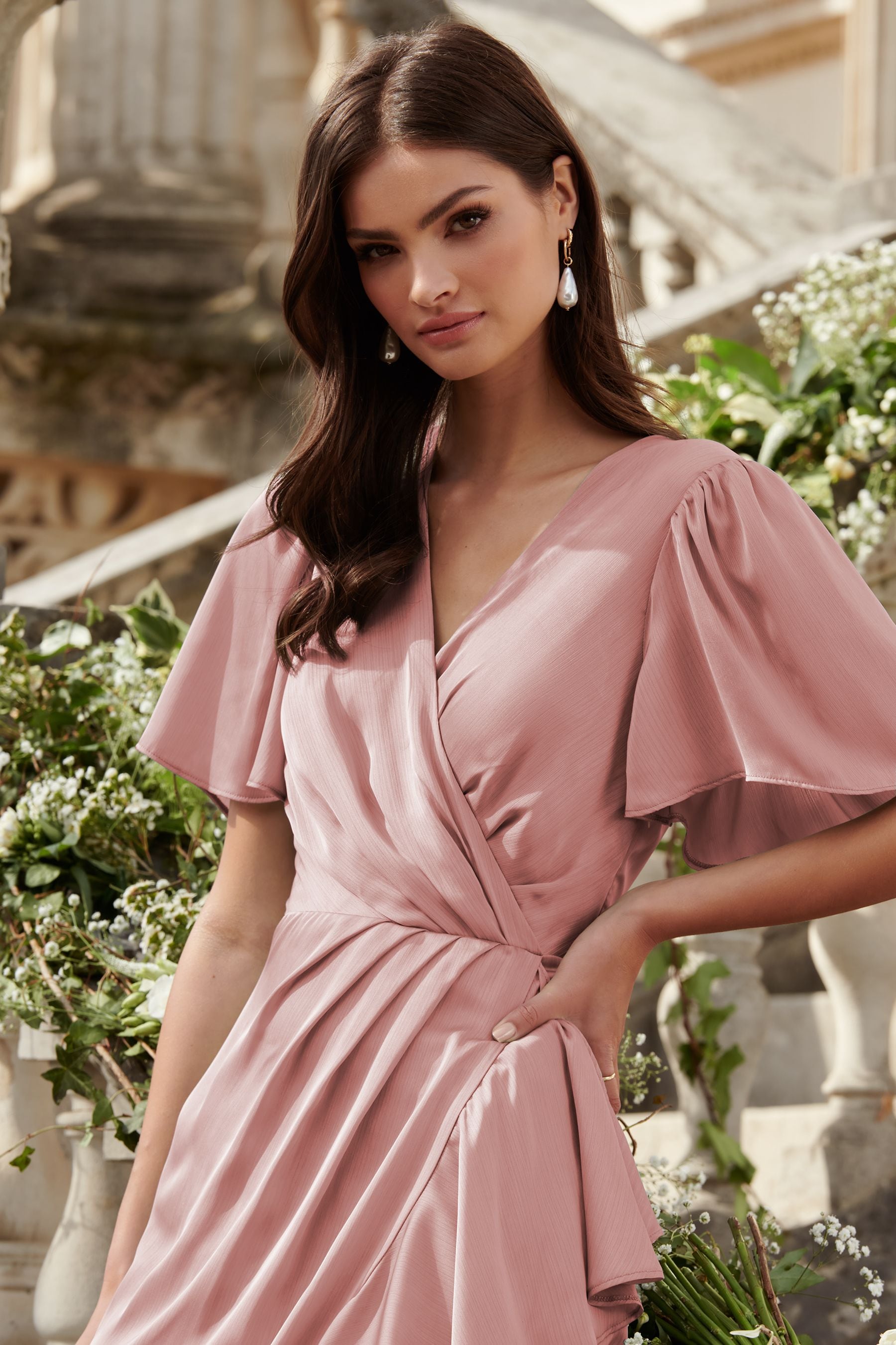 Buy Lipsy Pink Flutter Sleeve Wrap Front Bridesmaid Maxi Dress from ...