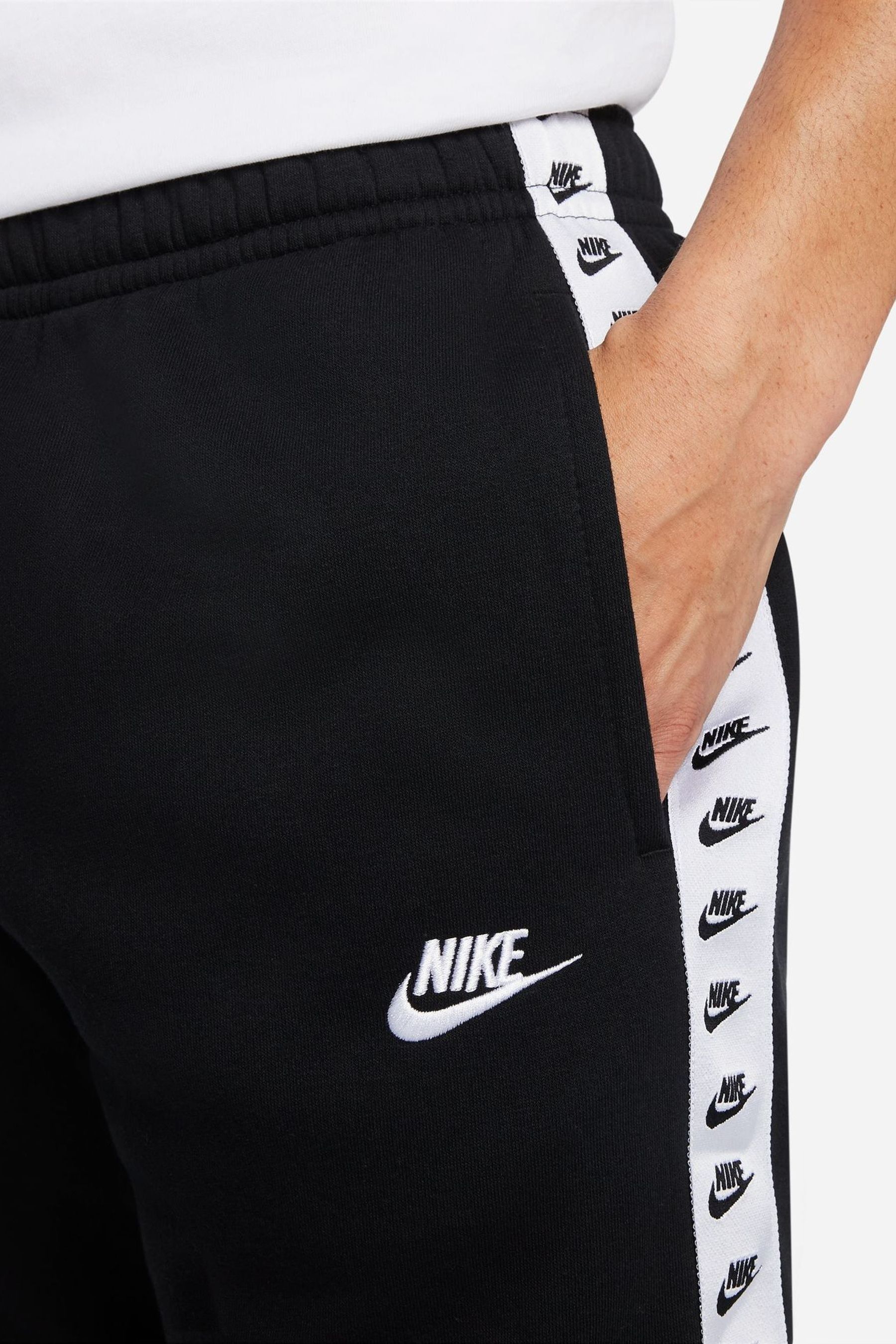 Buy Nike Black Sportswear Essential Hooded Tracksuit from the Next UK