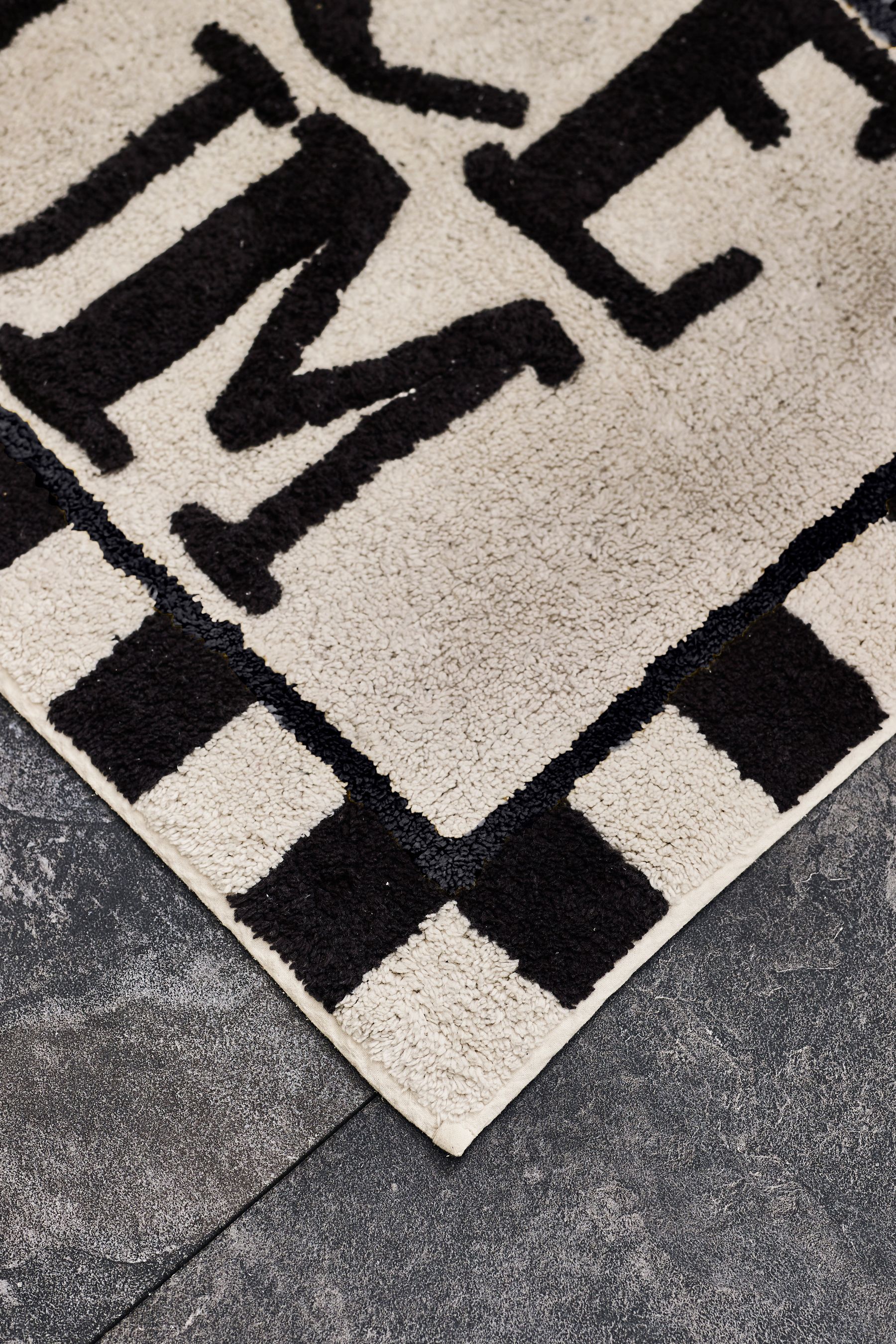 Buy Monochrome Slogan Bath Mat from the Next UK online shop
